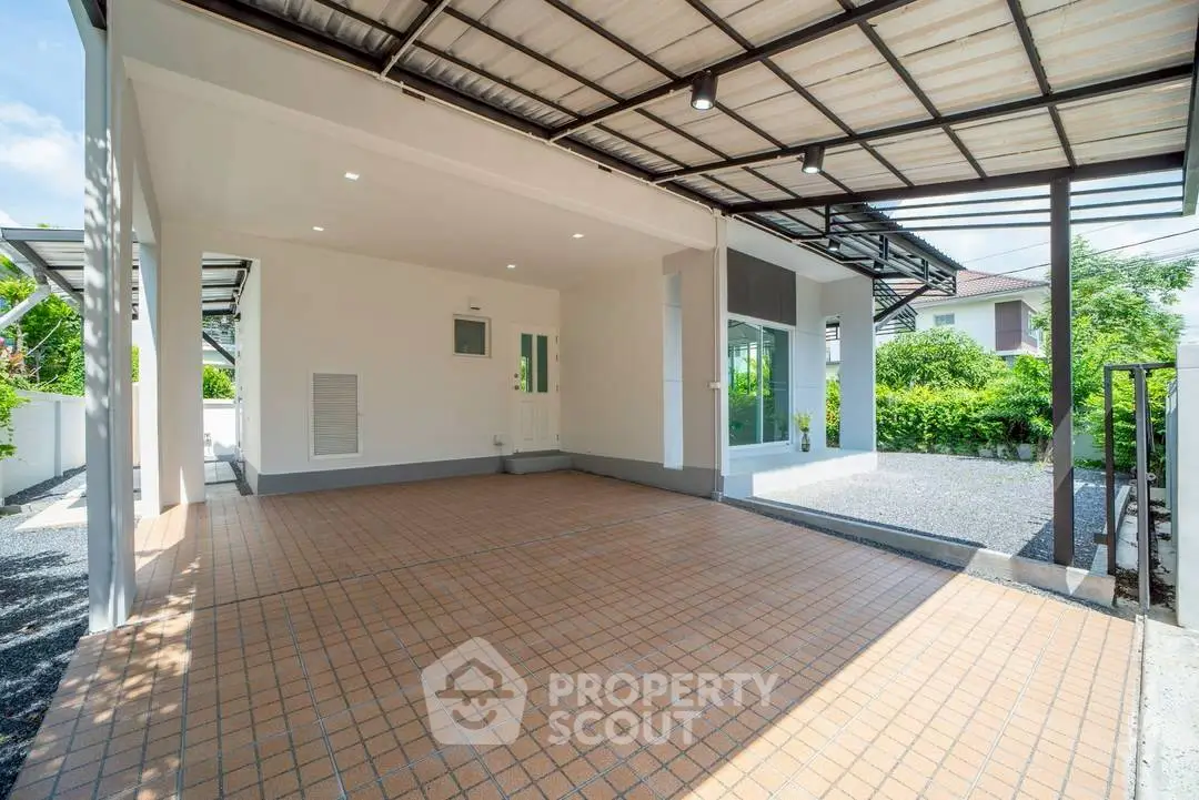 Spacious covered parking area with modern design and ample natural light.