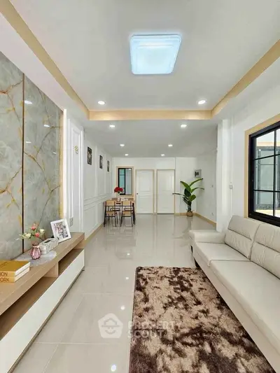 Spacious modern living room with elegant decor and natural light