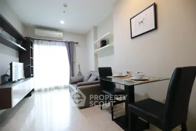 Modern living room with sleek furniture and natural light, perfect for cozy gatherings.