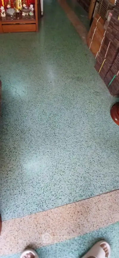 Spacious interior with terrazzo flooring and organized storage, ideal for versatile use.