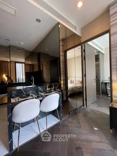 Modern apartment interior with sleek kitchen and cozy bedroom view