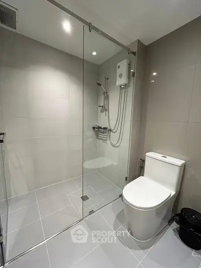 Modern bathroom with sleek glass shower and contemporary fixtures