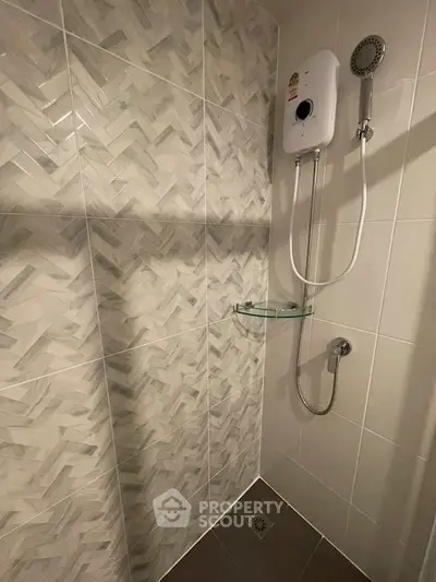 Modern bathroom with stylish tile design and shower unit