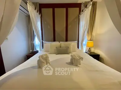 Luxurious bedroom with elegant decor and cozy ambiance, featuring a beautifully made bed and soft lighting.
