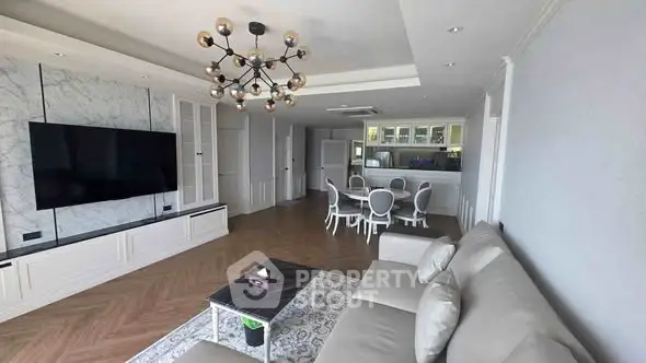 Spacious modern living room with elegant decor and open kitchen layout