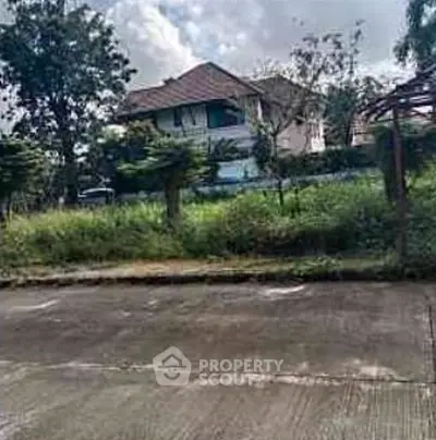 Charming suburban house with lush greenery and spacious surroundings