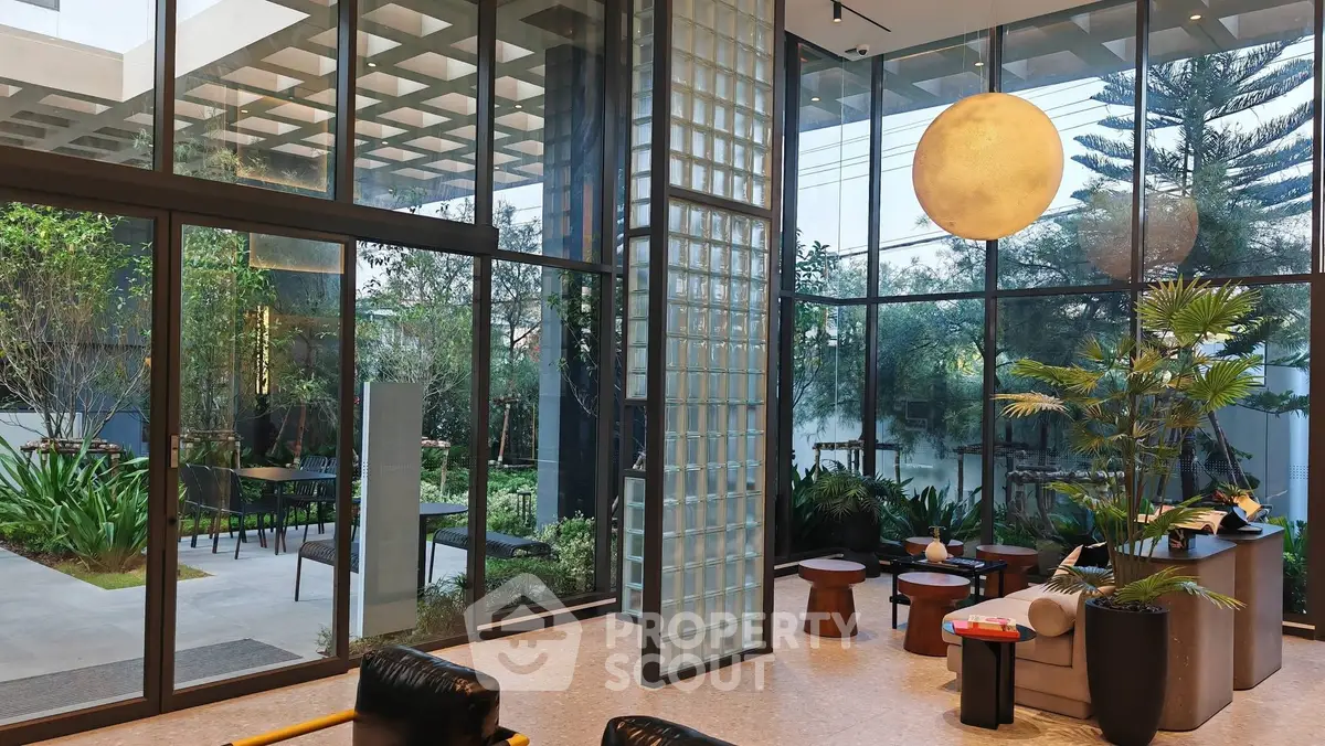 Luxurious modern living room with floor-to-ceiling windows and garden view