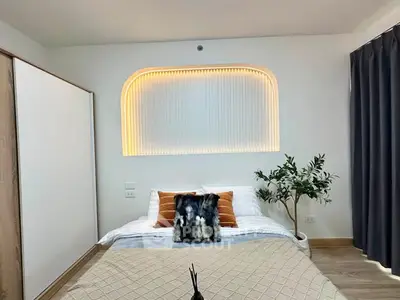 Modern bedroom with stylish lighting and cozy decor