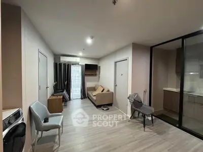 Modern living room with sleek furniture and open layout in contemporary apartment.