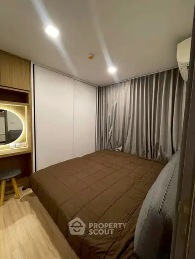 Cozy modern bedroom with stylish decor and ample storage space