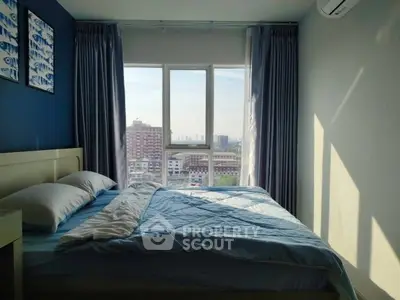 Cozy bedroom with city view and modern decor