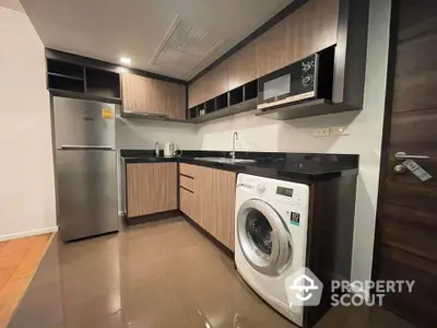 Modern kitchen with sleek appliances and stylish cabinetry