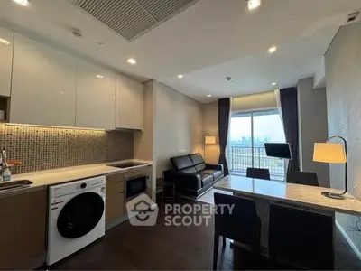 Modern open-layout living room with kitchen and city view balcony