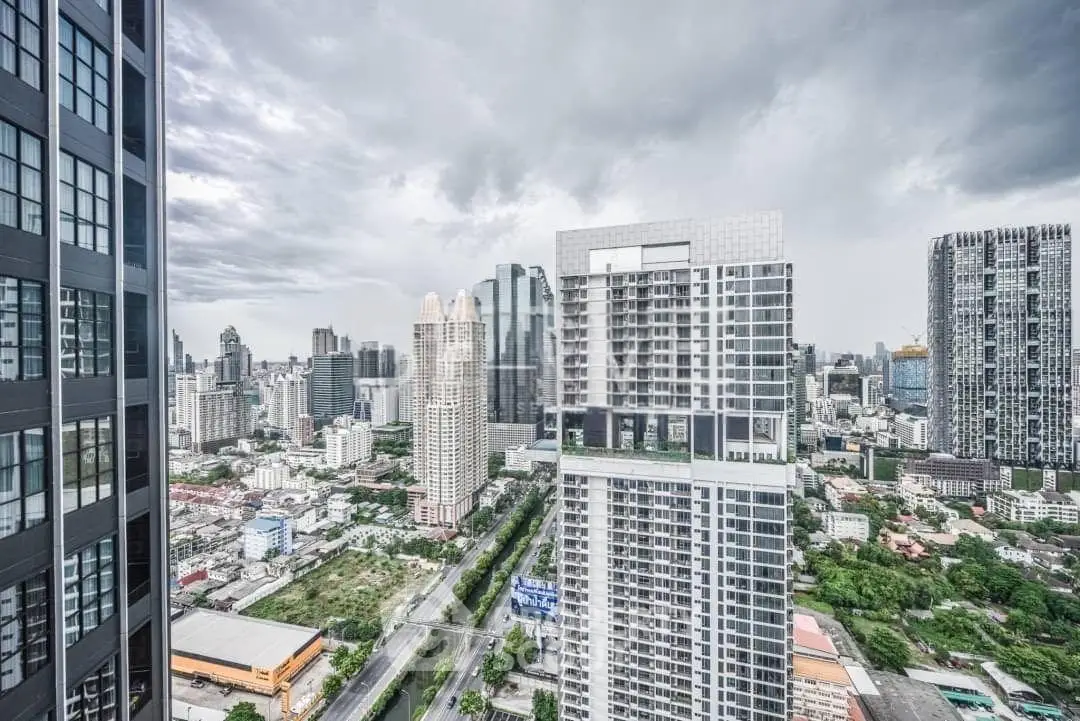 Stunning cityscape view from a high-rise building showcasing modern architecture and urban skyline.