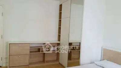Modern bedroom with built-in wardrobe and minimalist design