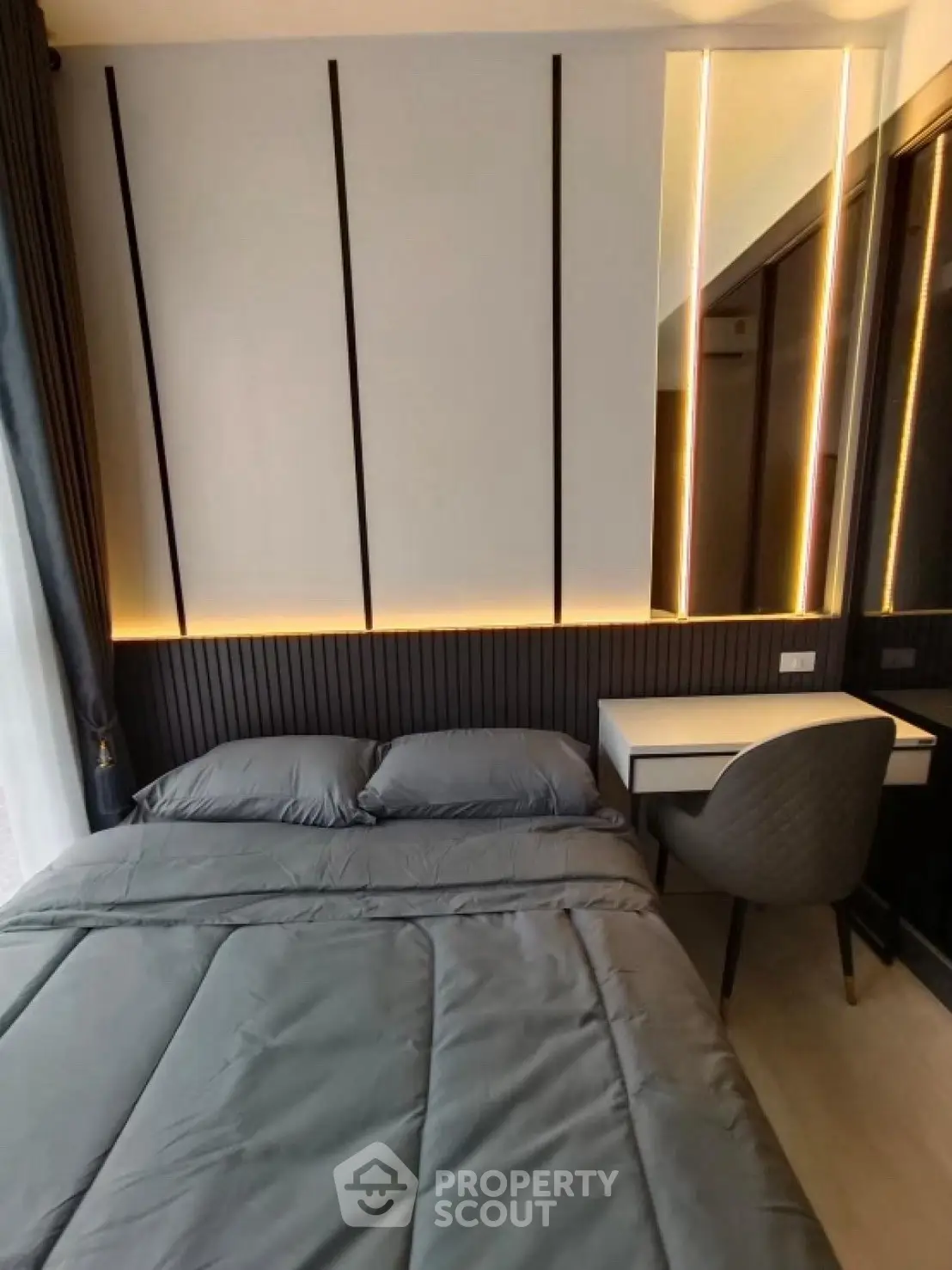 Modern bedroom with sleek design and ambient lighting