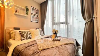 Cozy bedroom with large windows and stylish decor in modern apartment