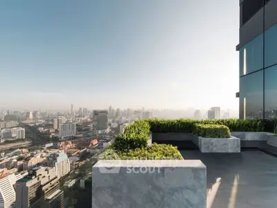 Stunning rooftop view of city skyline with lush greenery and modern design.