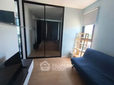 Modern living room with sleek glass partition and natural light