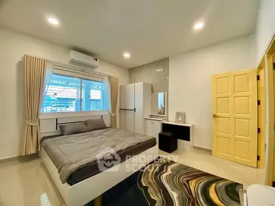 Modern bedroom with stylish decor and natural light