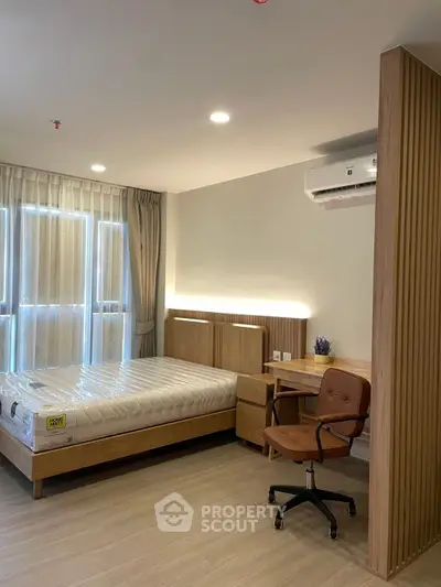 Modern bedroom with stylish furniture and natural light