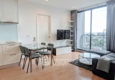 Modern living room with dining area and city view balcony