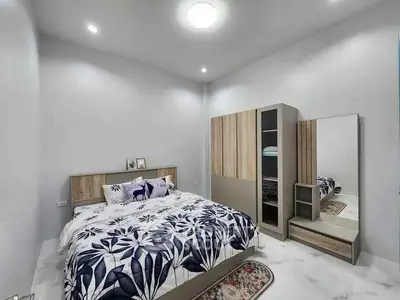 Modern bedroom with stylish decor and spacious wardrobe
