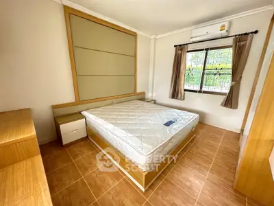 Spacious bedroom with modern design and natural light