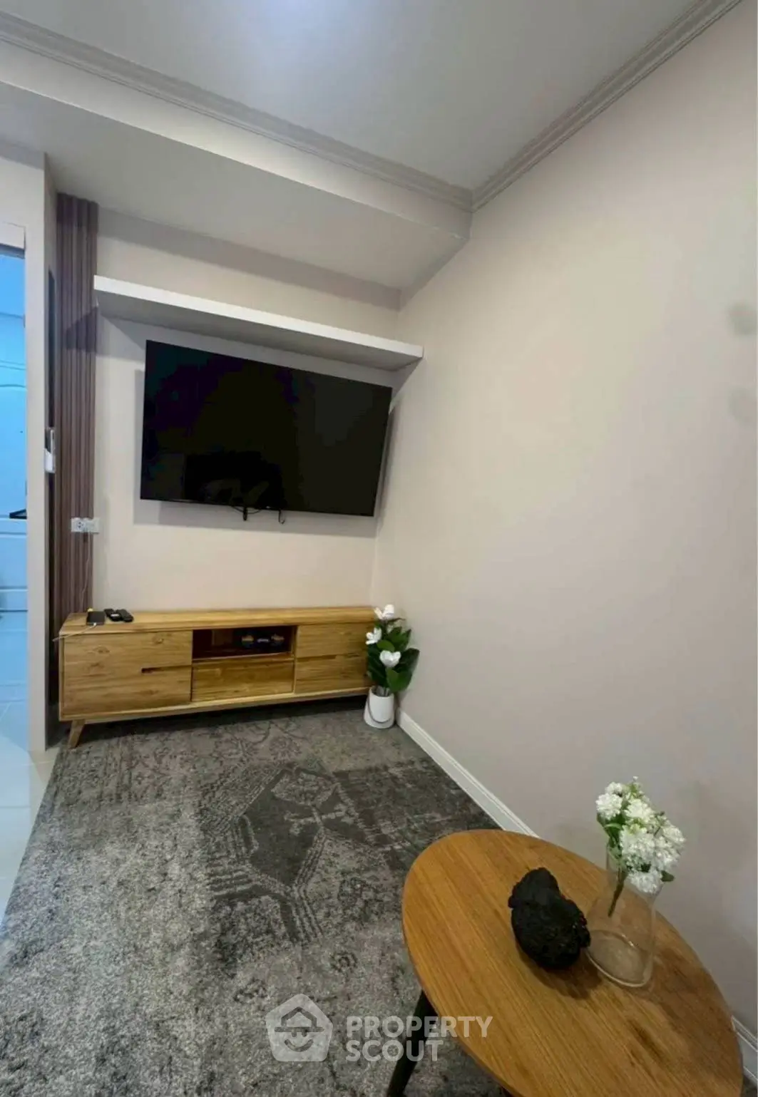 Modern living room with sleek TV setup and stylish decor