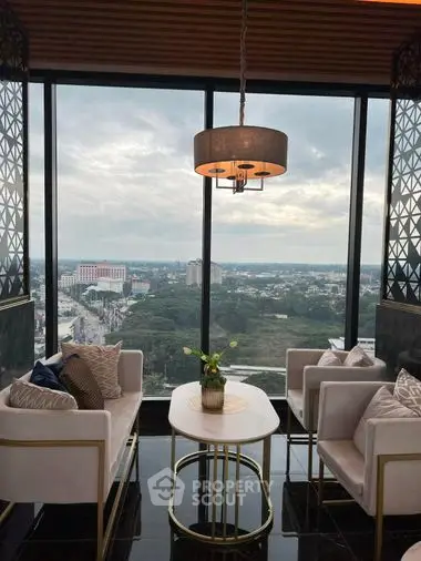 Luxurious high-rise corner unit living room with panoramic city views, elegant furnishings, and a chic chandelier, perfect for upscale urban living.