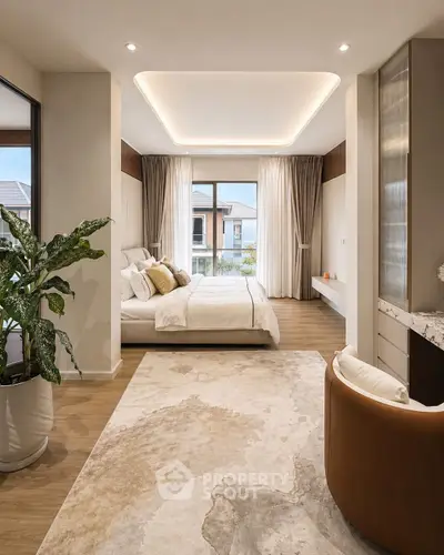 Luxurious bedroom with elegant decor and large windows offering a serene view, perfect for relaxation.