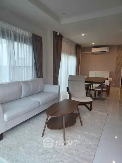 Modern living room with sleek furniture and natural light