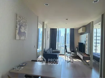 Modern living room with city view, stylish decor, and natural light