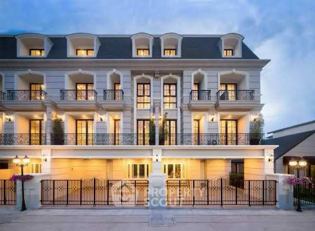 Elegant multi-story building with classic architecture and balconies, perfect for luxury living.