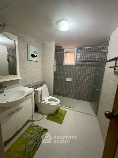 Modern bathroom with glass shower and stylish decor