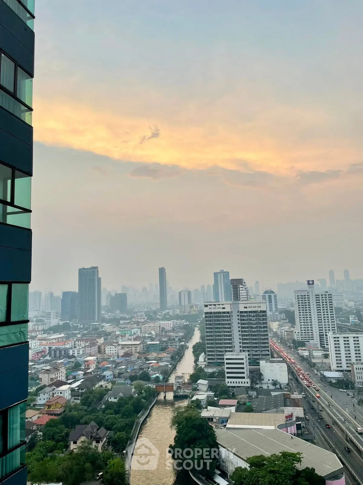 Stunning cityscape view from high-rise building at sunset