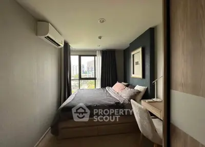 Modern bedroom with city view, featuring cozy bed and stylish decor in a high-rise apartment.