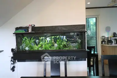 Stylish dining area with built-in aquarium and modern furniture