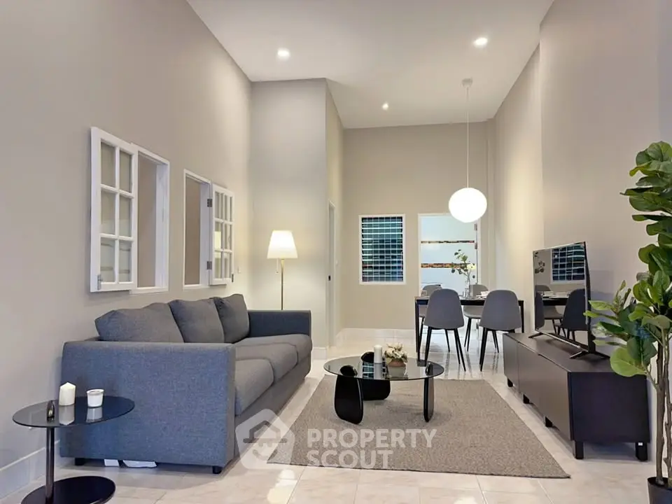 Spacious modern living room with stylish furniture and elegant decor, perfect for relaxation and entertainment.