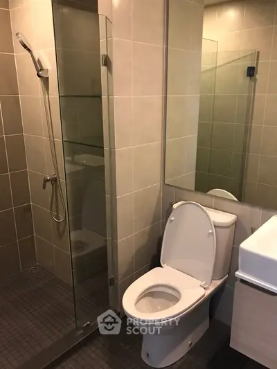 Modern bathroom with glass shower and sleek fixtures