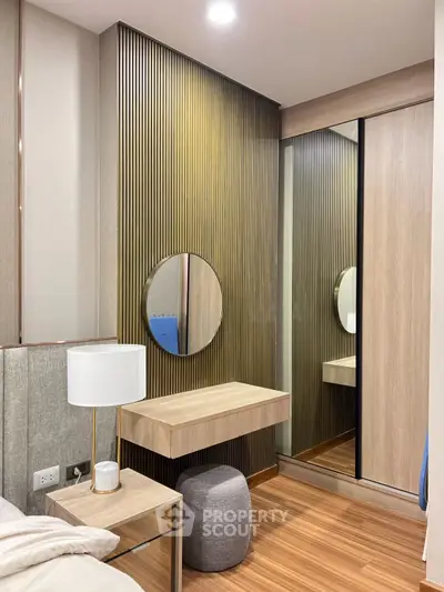 Modern bedroom with stylish wood paneling and mirrored wardrobe