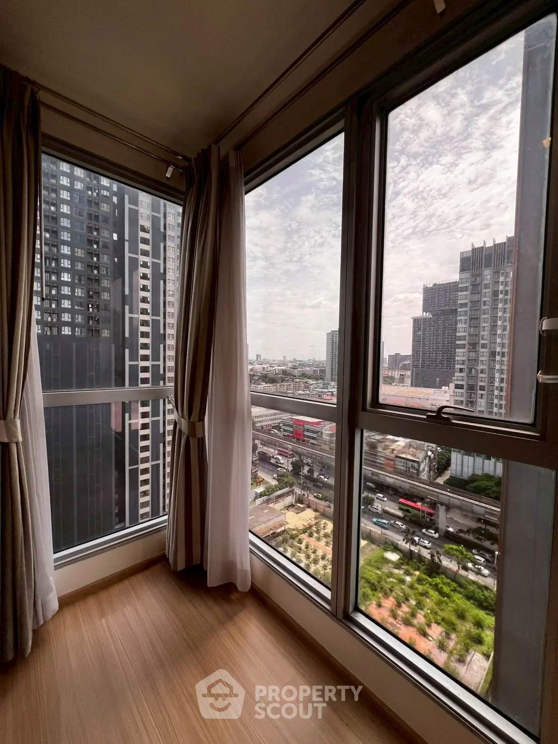 Stunning corner unit with panoramic city views and floor-to-ceiling windows.