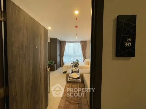 Modern apartment entrance with cozy living room and stylish decor