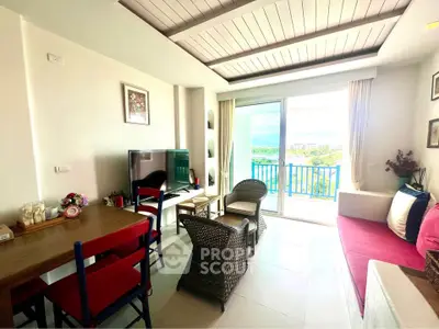 Bright living room with modern decor and stunning balcony view