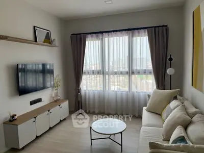 Modern living room with large window and stylish decor