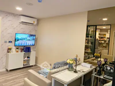 Modern living room with stylish decor and open kitchen layout