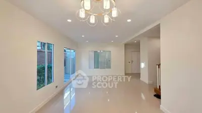 Spacious modern living room with elegant lighting and large windows