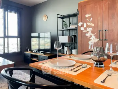 Modern living room with dining area, stylish decor, and large windows offering natural light.