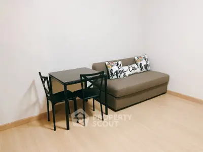 Cozy minimalist living room with sofa and dining table set