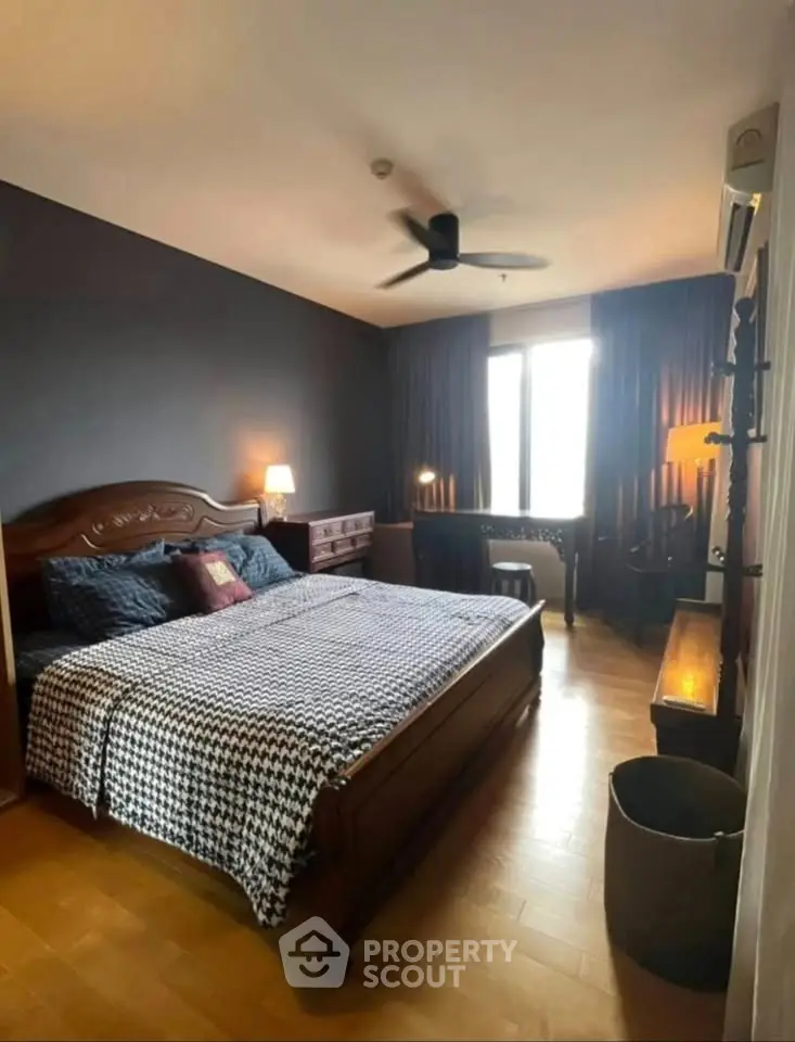 Cozy bedroom with elegant wooden furniture and natural light, perfect for relaxation and comfort.